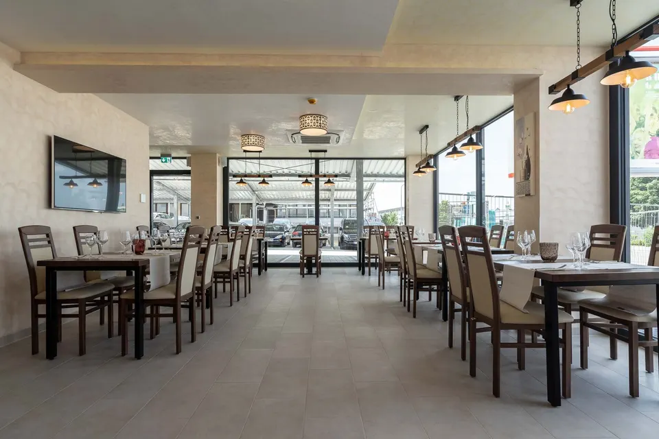 Restaurant with set tables and large windows